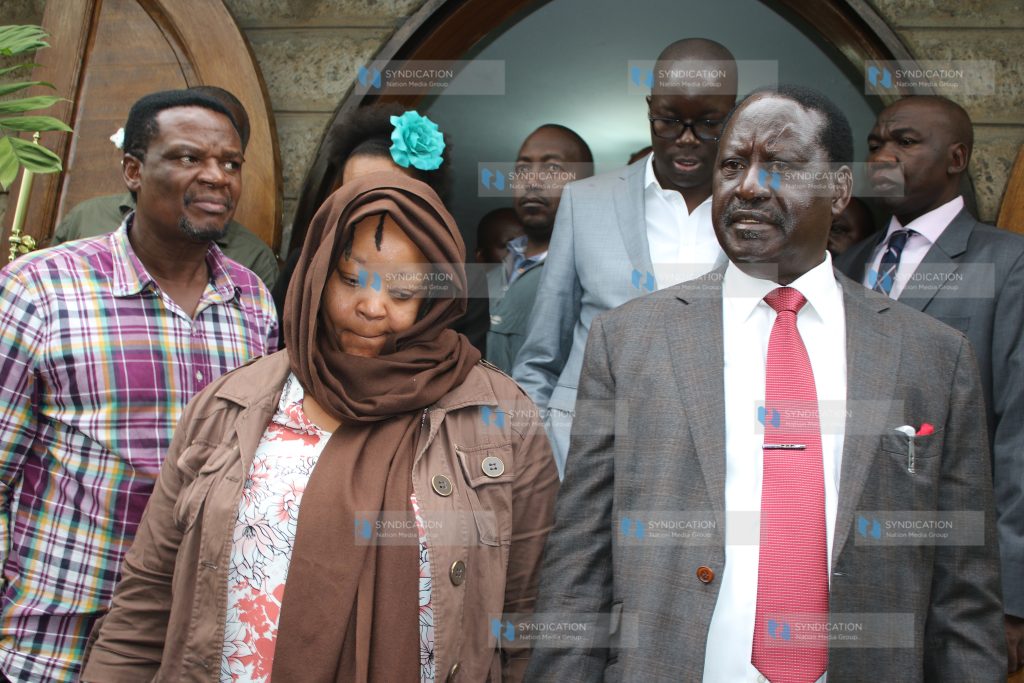 Ms. Miriam Juma, wife of the late Jacob Juma, is accompanied by CORD leader Raila Odinga