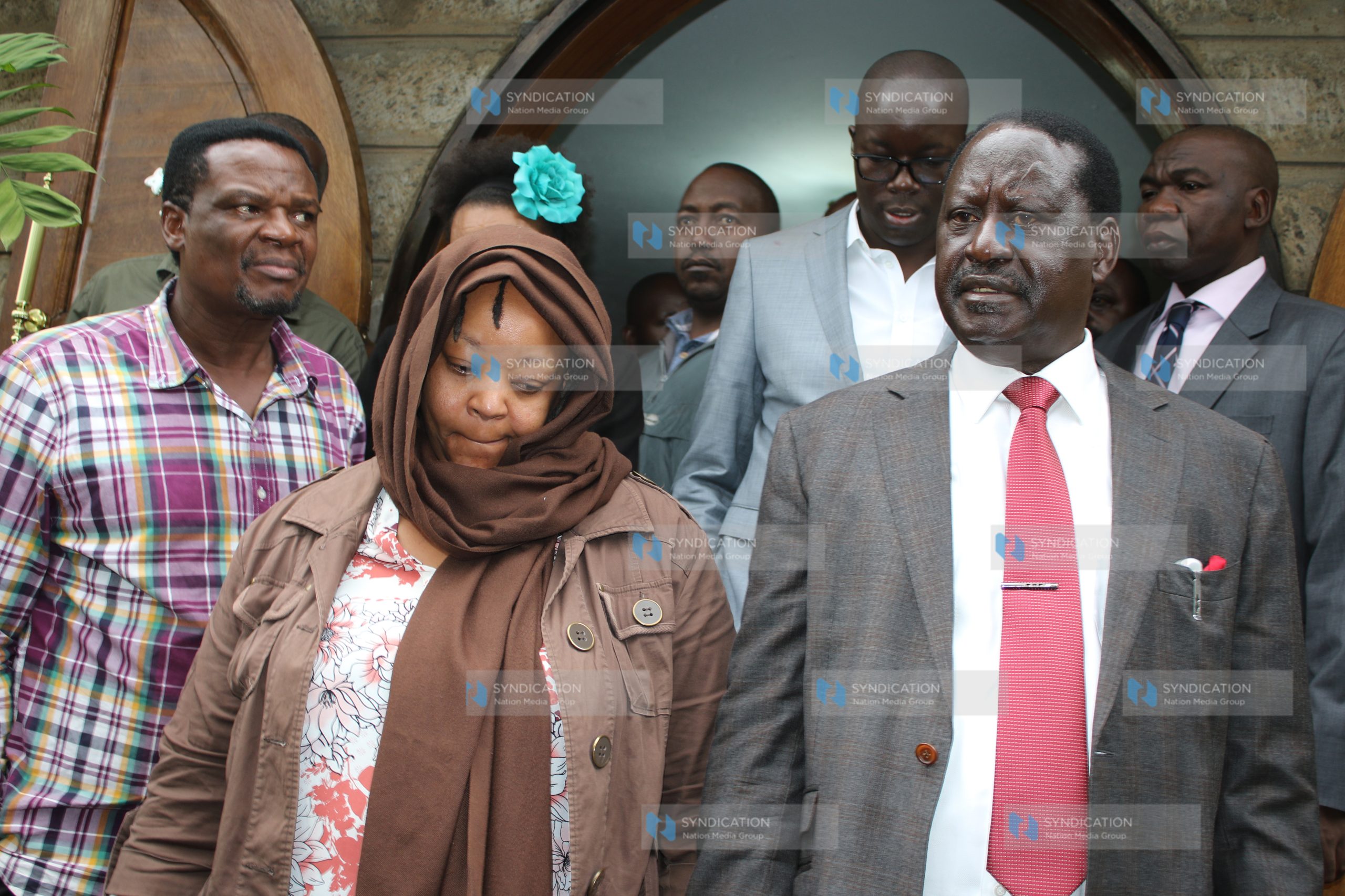 Ms. Miriam Juma, wife of the late Jacob Juma, is accompanied by CORD leader Raila Odinga