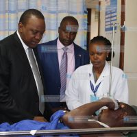 President Uhuru Kenyatta with Kieni MP Kanini Kega