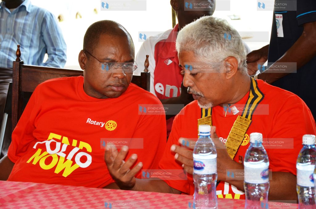 Amason Kingi shares a word with the president Malindi rotary club Mr. Feswal Osman