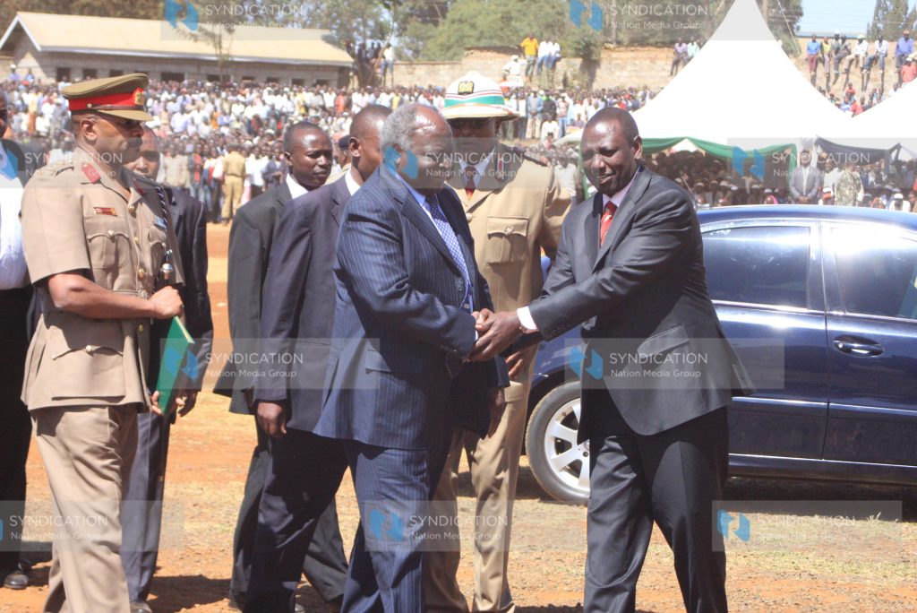 President Mwai Kibaki is welcomed by suspended Higher Education Minister William Ruto