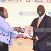 Deputy President Rigathi Gachagua receives a gift from Council of Governors Chairperson Ann Waiguru