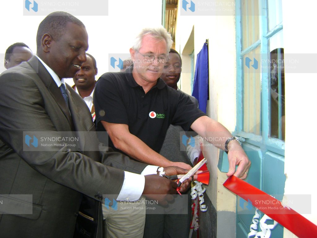 Agriculture Minister William Ruto accompanied by Safaricom Chairman Les Baillie