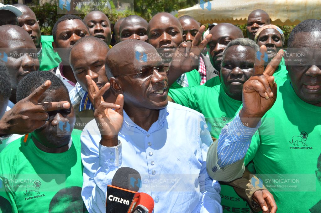 Senator of Kakamega Boni Khalwale interacts with former UDF supporters