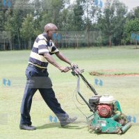 Ikolomani MP Dr. Boni Khalwale cutting green grass