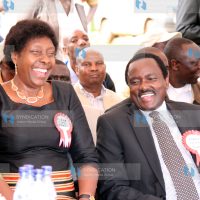 Kalonzo Musyoka shares a light-hearted moment with water and Irrigation Minister Charity Ngilu