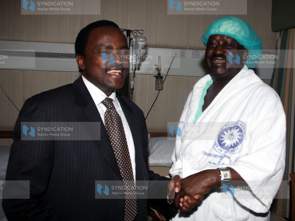 Kalonzo Musyoka comforts Prime Minister Raila Odinga