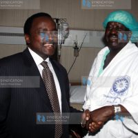 Kalonzo Musyoka comforts Prime Minister Raila Odinga