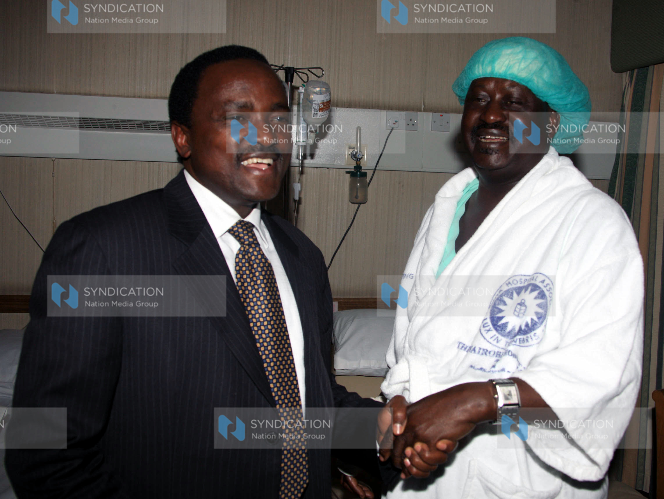Kalonzo Musyoka comforts Prime Minister Raila Odinga