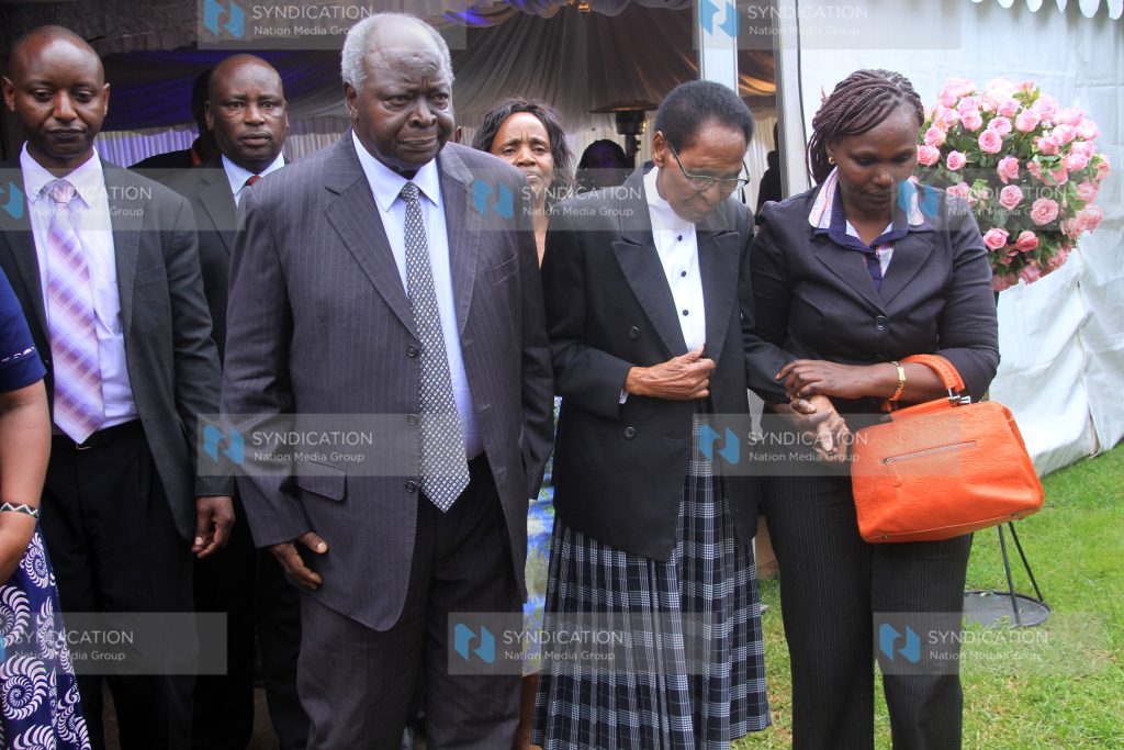 Former President Mwai Kibaki consoles Mama Edith Matiba (2nd right)