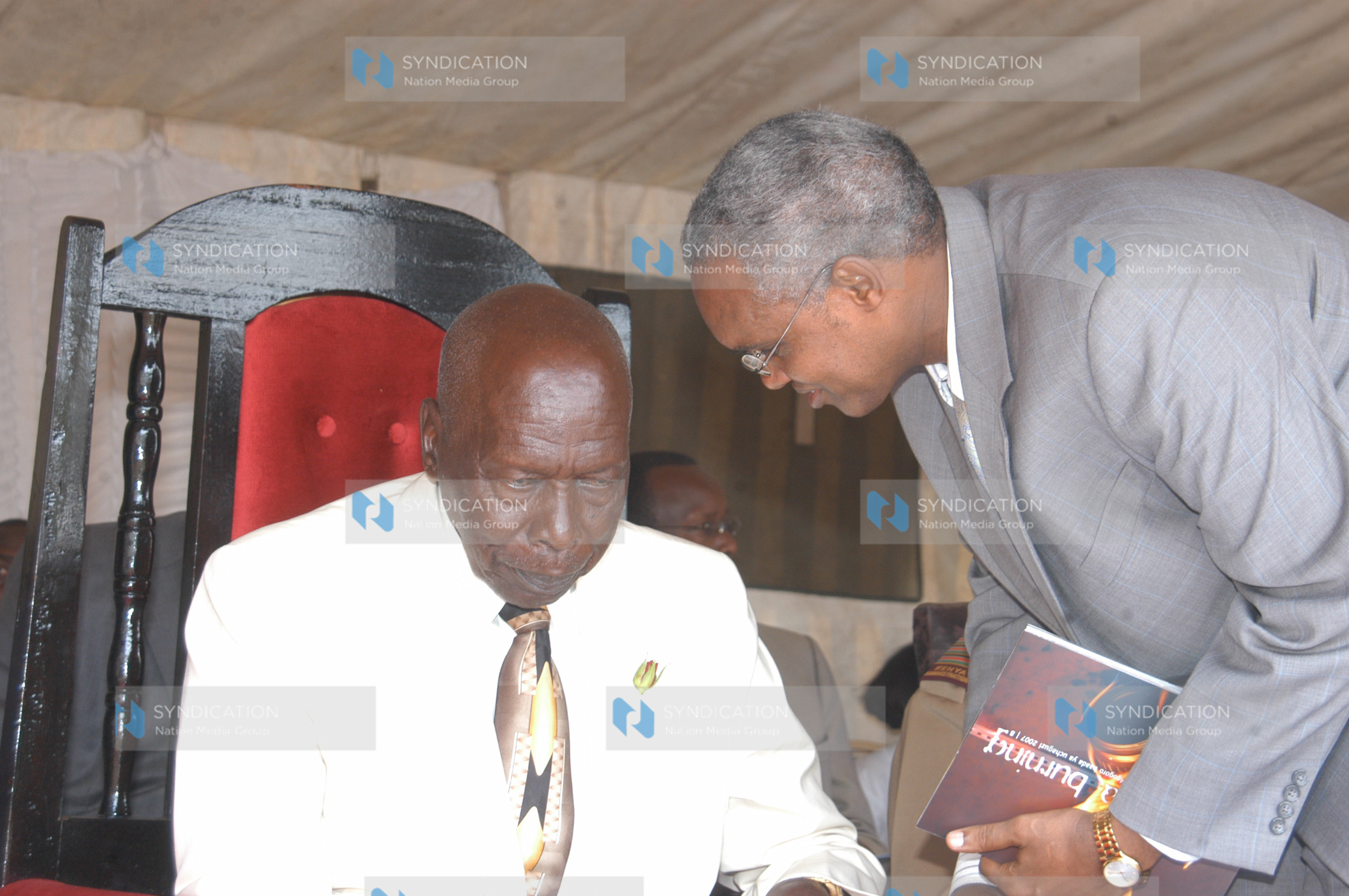 Former President Daniel arap Moi chats with Special Programme Permanent Secretary Ali Mohammed