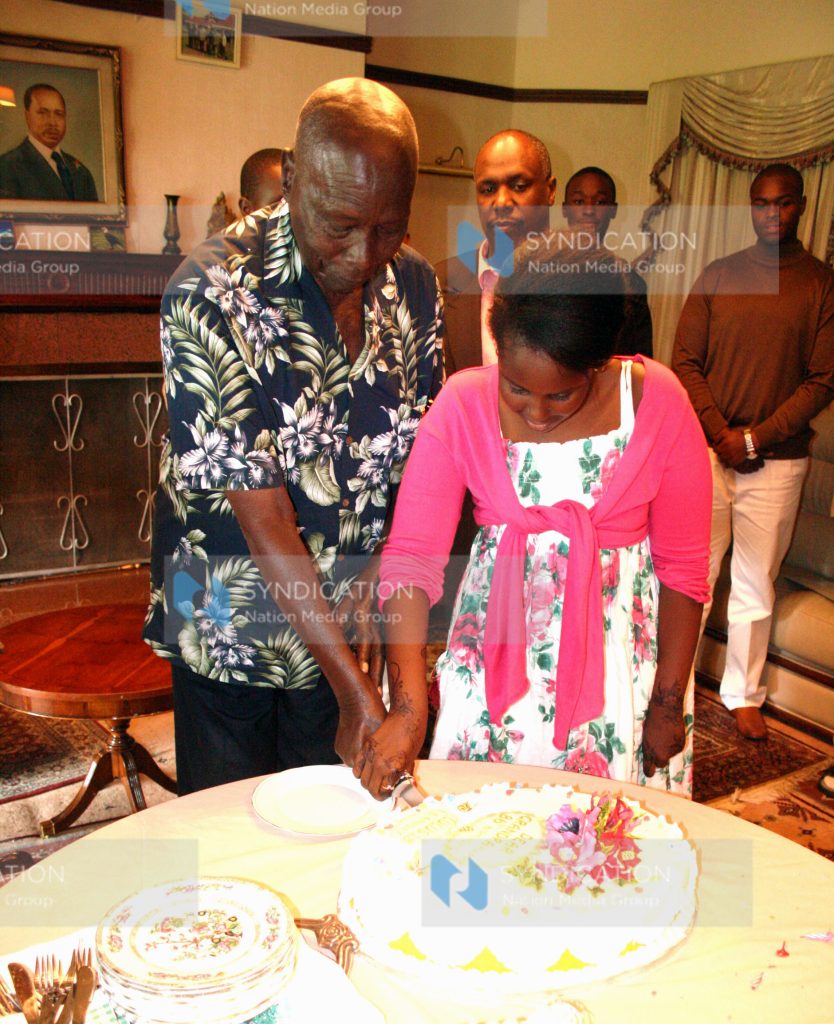Former President Daniel arap Moi cuts a cake to mark his 86th birthday