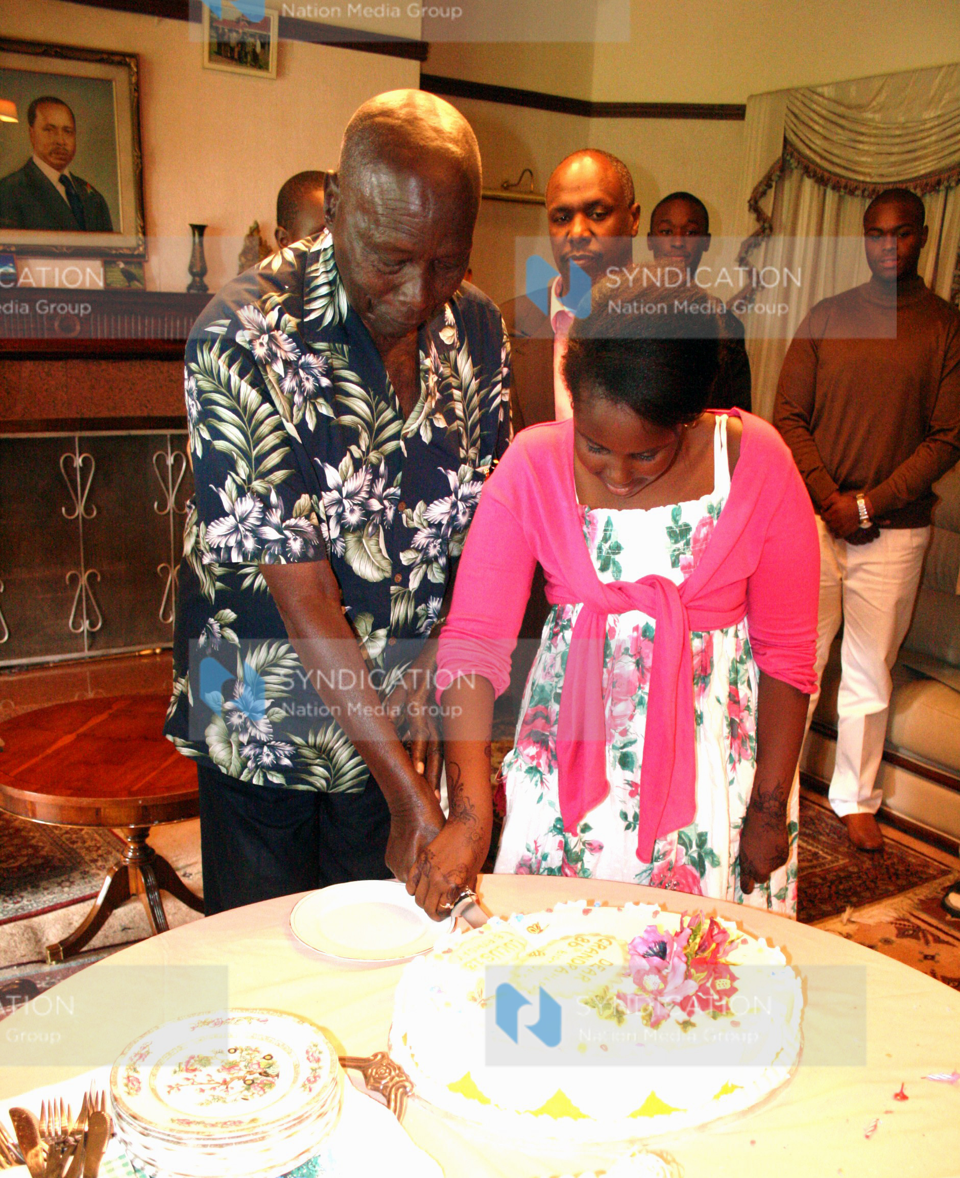 Former President Daniel arap Moi cuts a cake to mark his 86th birthday