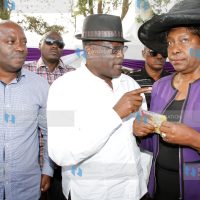 Machakos Senator Johnston Muthama (center)