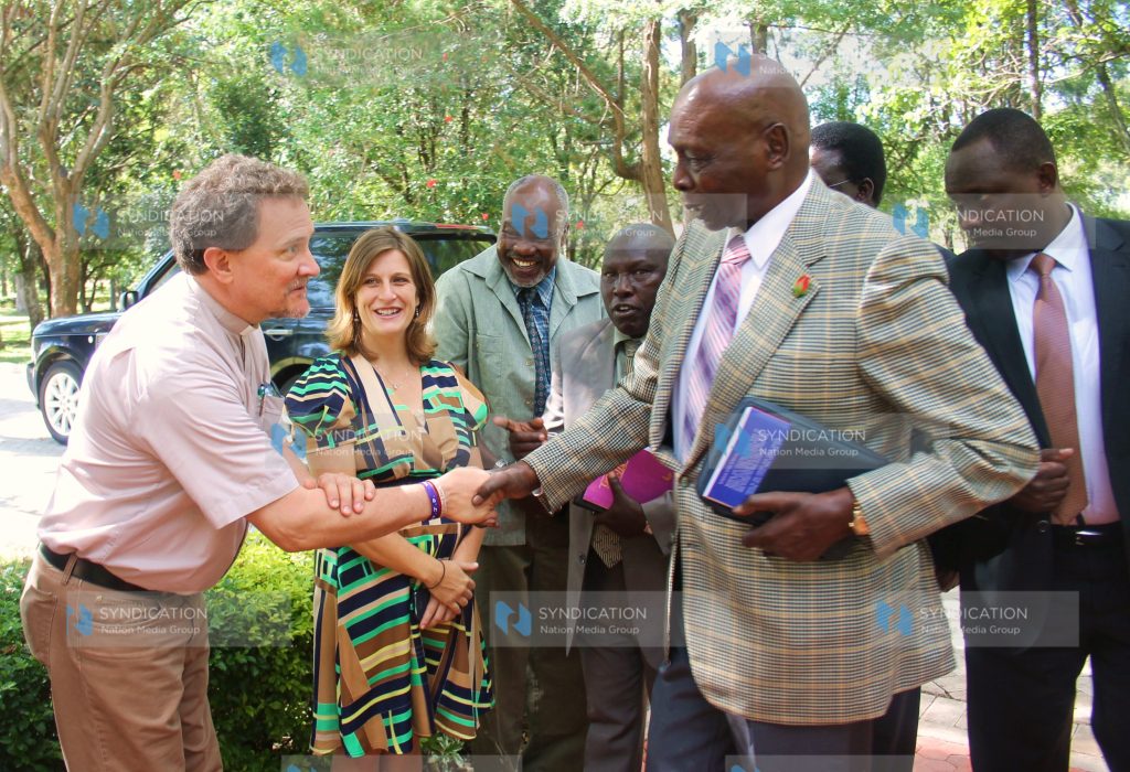 Former President Daniel arap Moi is introduced to Rev. John Bomhal