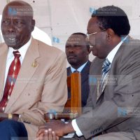 Nakuru County Council Chairman John Kamau Murigo consults with former President Daniel arap Moi