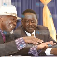 Prime Minister Raila Odinga confers with former Vice President Moody Awori