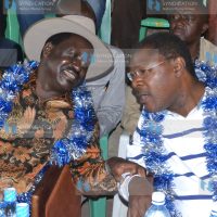 Former Prime Minister Raila Odinga converses with Senator Moses Wetangula