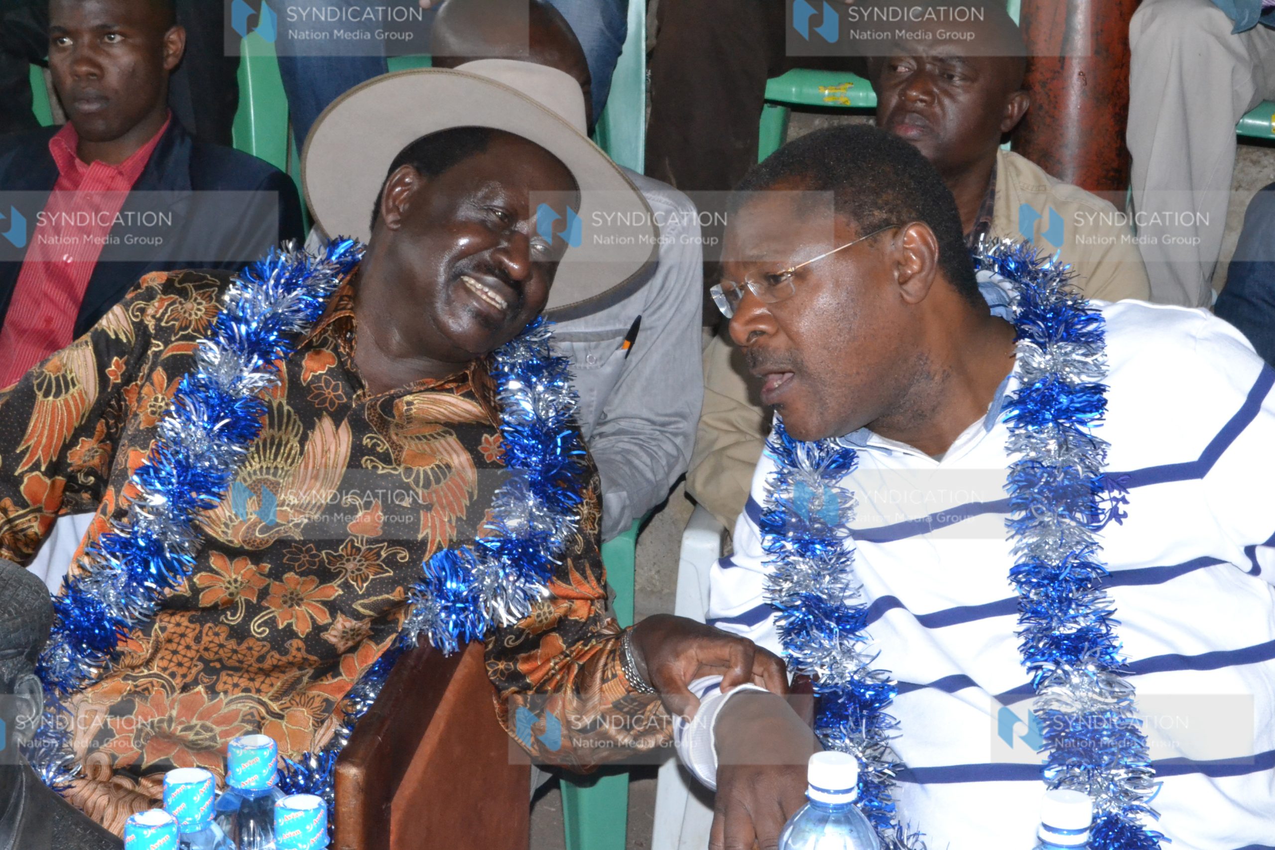 Former Prime Minister Raila Odinga converses with Senator Moses Wetangula
