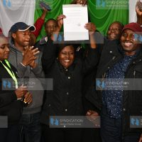 Embu governor-elect Cecily Mbarire holds up her certificate after being declared winner in the gubernatorial race