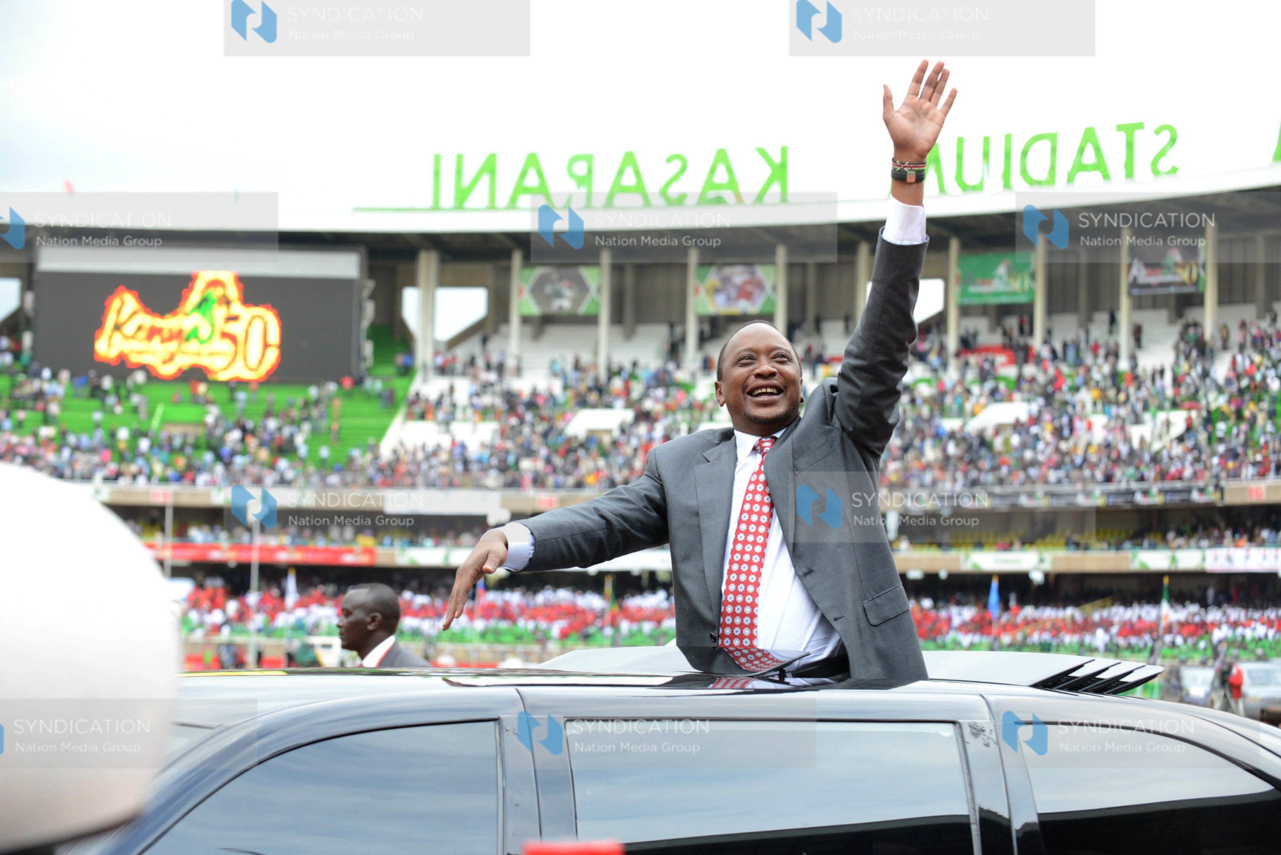 President Uhuru Kenyatta acknowledges greetings from wananchi