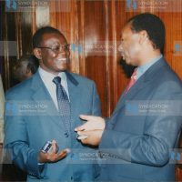 Justice and Constitutional Affairs minister Kiraitu Murungi chats with KANU MP Henry Kosgey