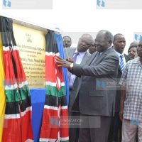 President Mwai Kibaki unveils a commemorative plaque