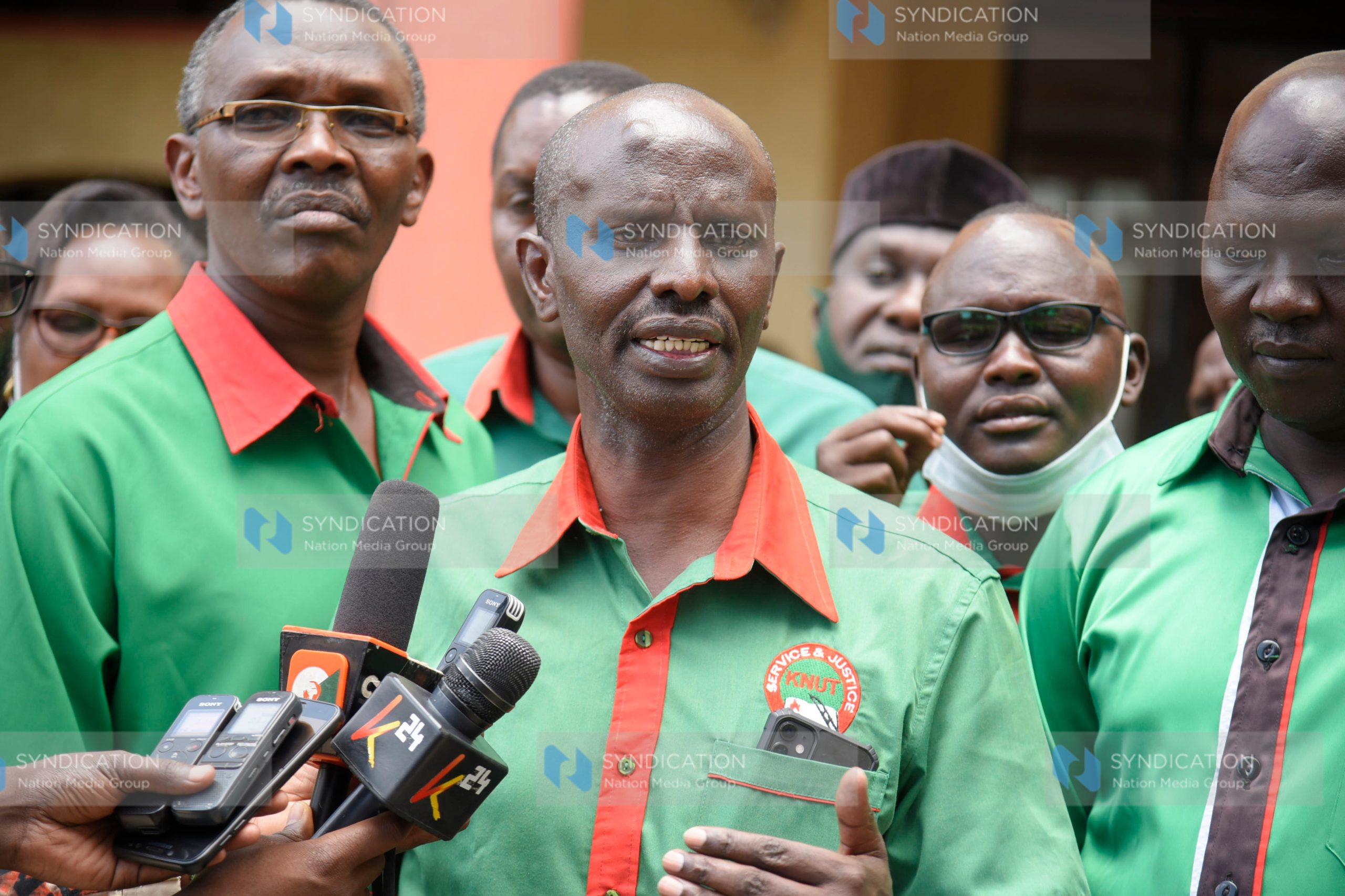 Wilson Sossion (Speaking) with other union leaders address journalists
