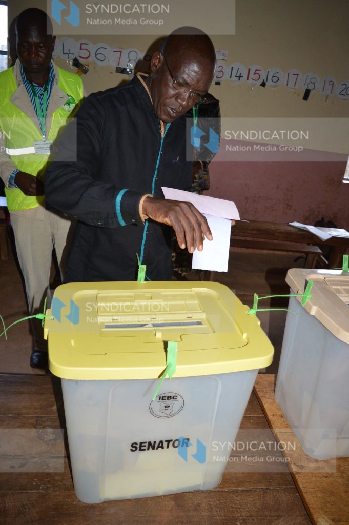 Dr. Boni Khalwale casts his ballot at Malinya Primary School polling station