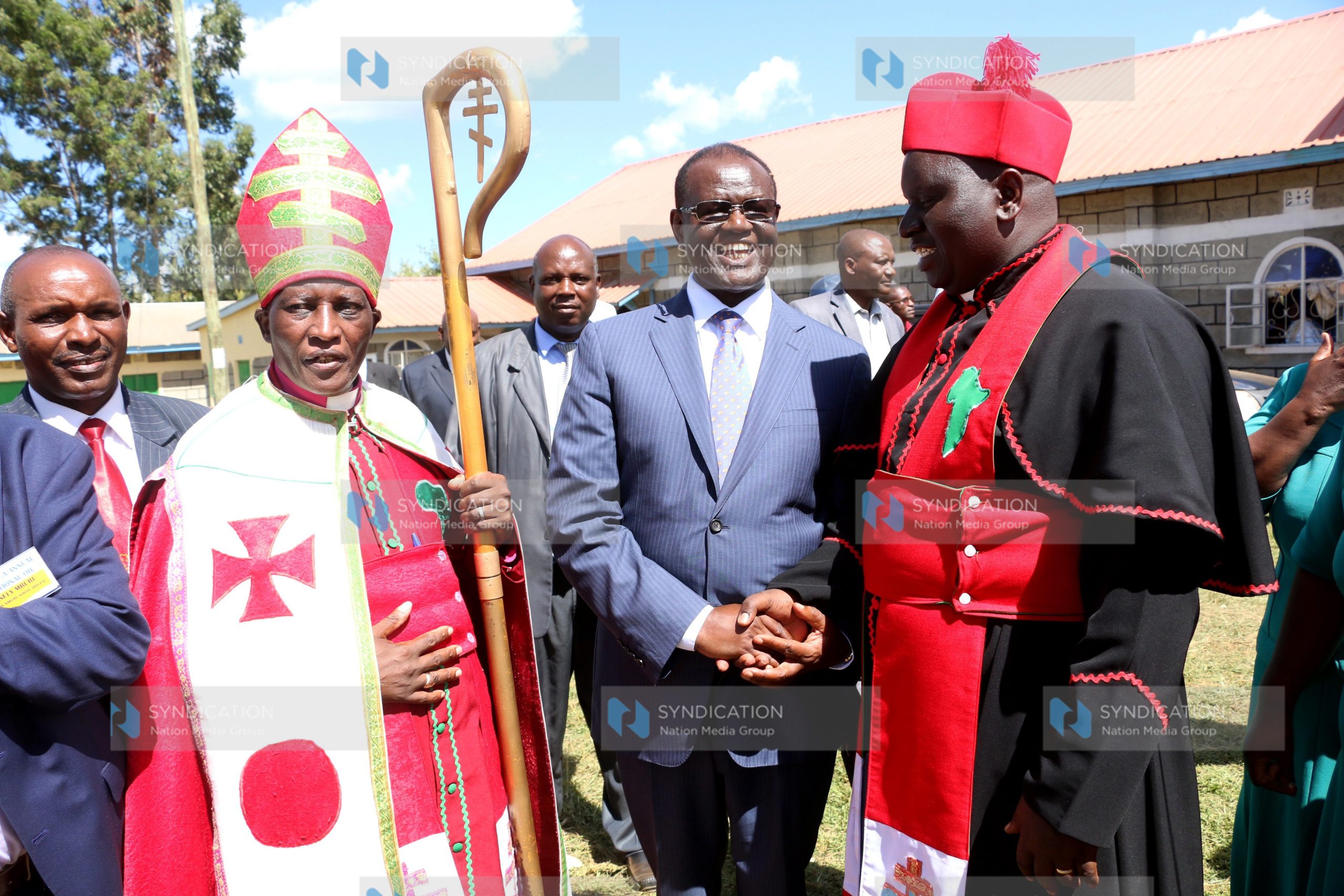 Meru Governor Kiraitu Murungi (center) chats with AIPCA Archbishop Julius Njoroge Gitau