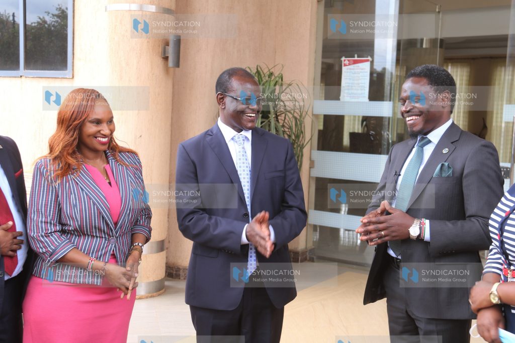 Meru Governor Kiraitu Murungi (center) chats with LSK President Nelson Havi (right)