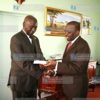 Former President Daniel Arap Moi receives a book titled Constitution-making