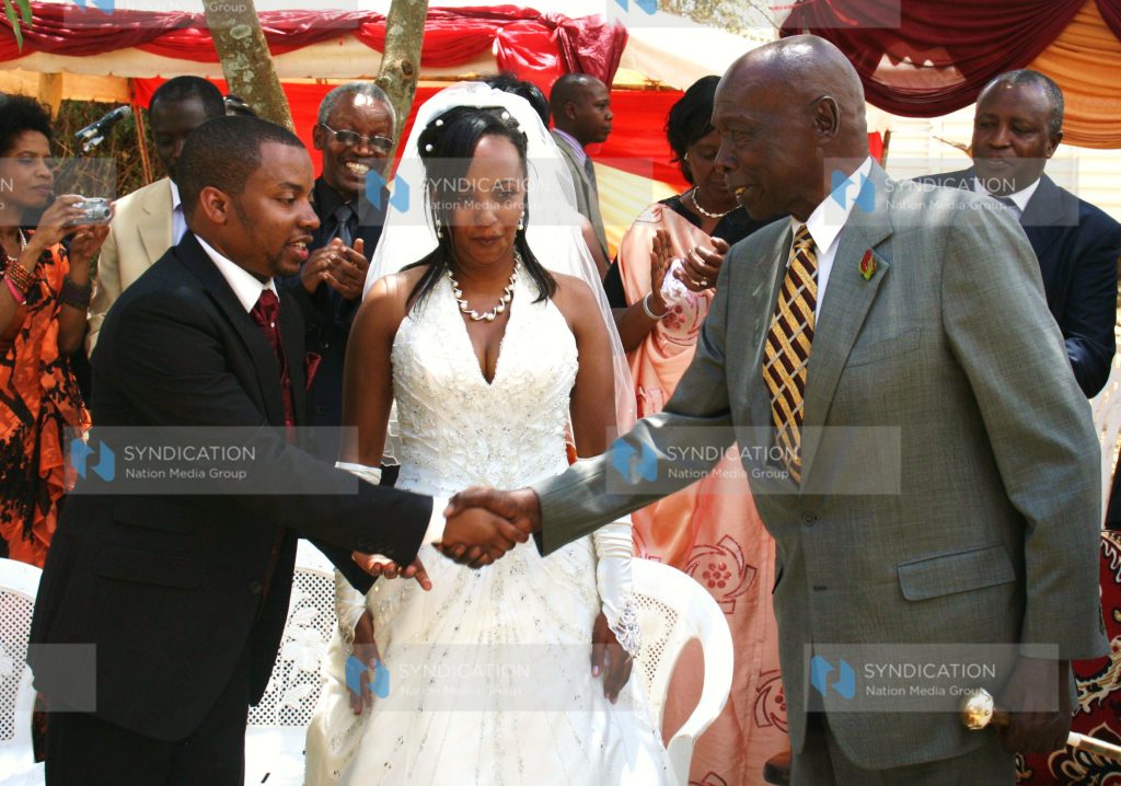 Former President Daniel arap Moi congratulates the newlyweds