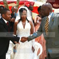 Former President Daniel arap Moi congratulates the newlyweds