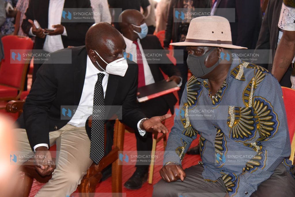 Deputy President William Ruto confers with ODM leader Raila Odinga