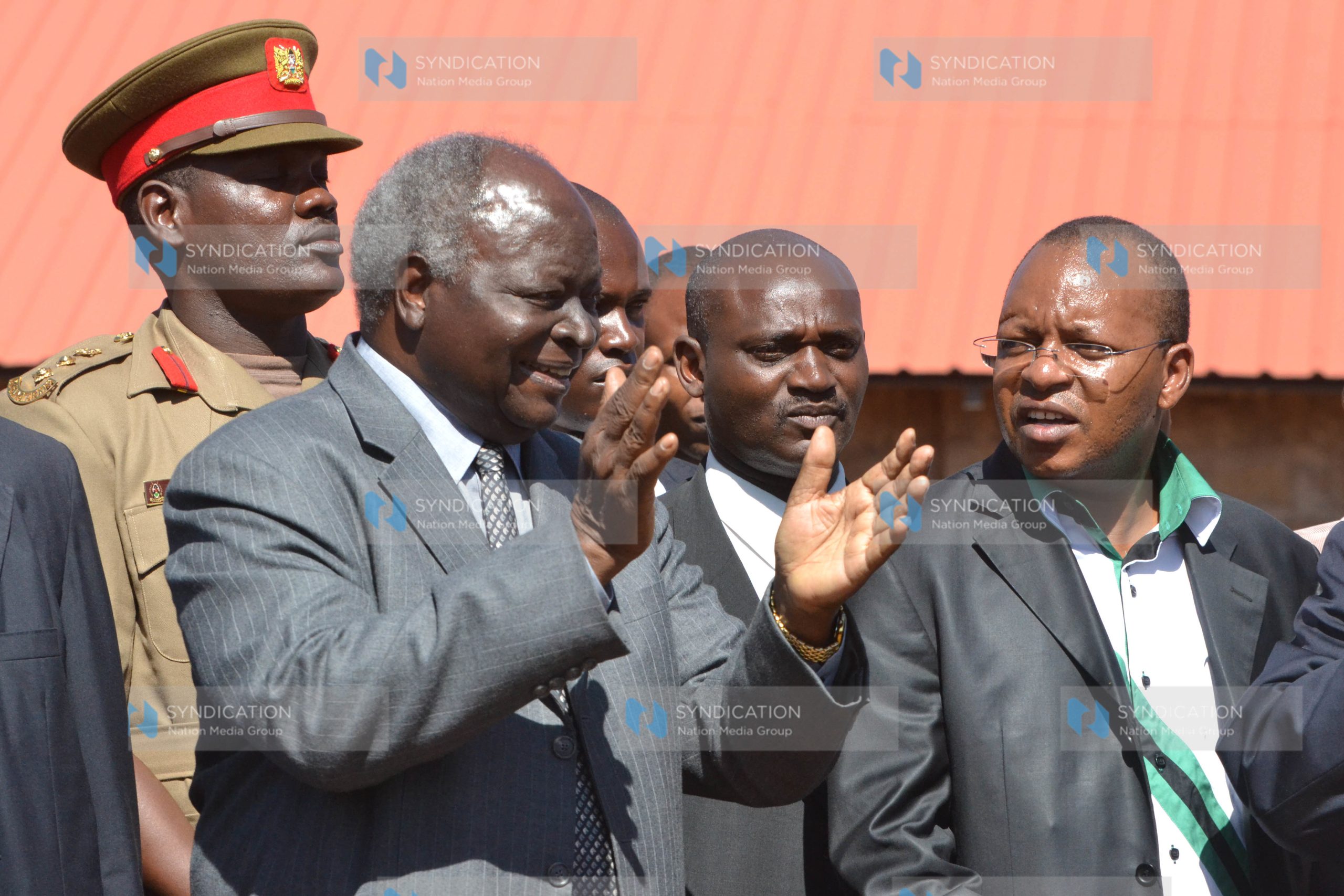President Mwai Kibaki in a happy moment at Giathenge trading center in Othaya