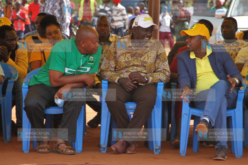 Deputy President William Ruto chats with James Mbaluka and Daniel Musau