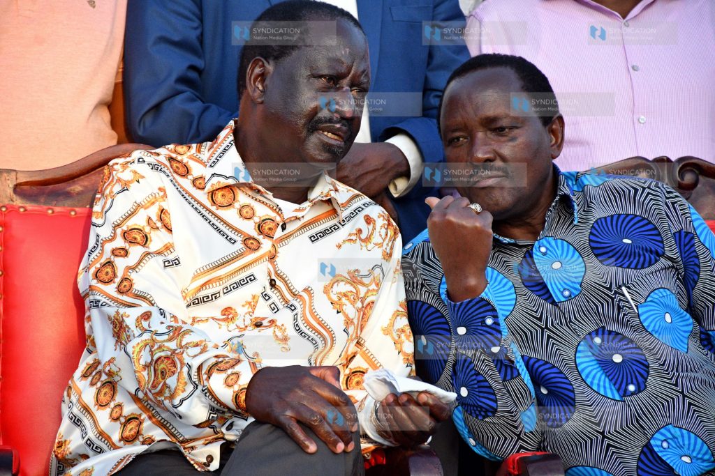 Raila Odinga (left) confers with Wiper Party Leader Kalonzo Musyoka (left)