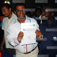 Senator candidate Mr.Hassan Omar displaying his clearance certificate