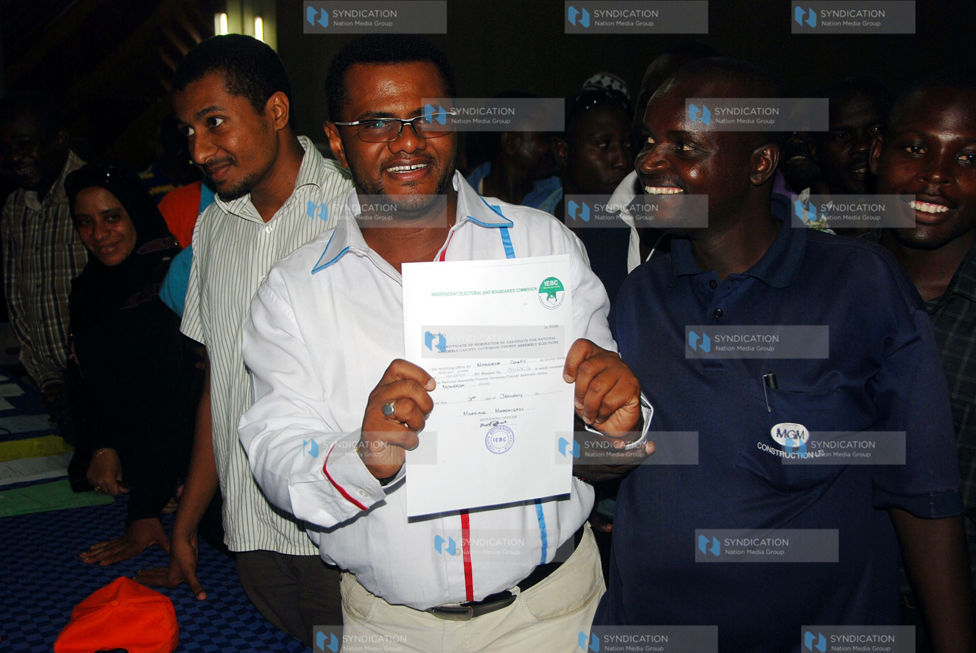 Senator candidate Mr.Hassan Omar displaying his clearance certificate