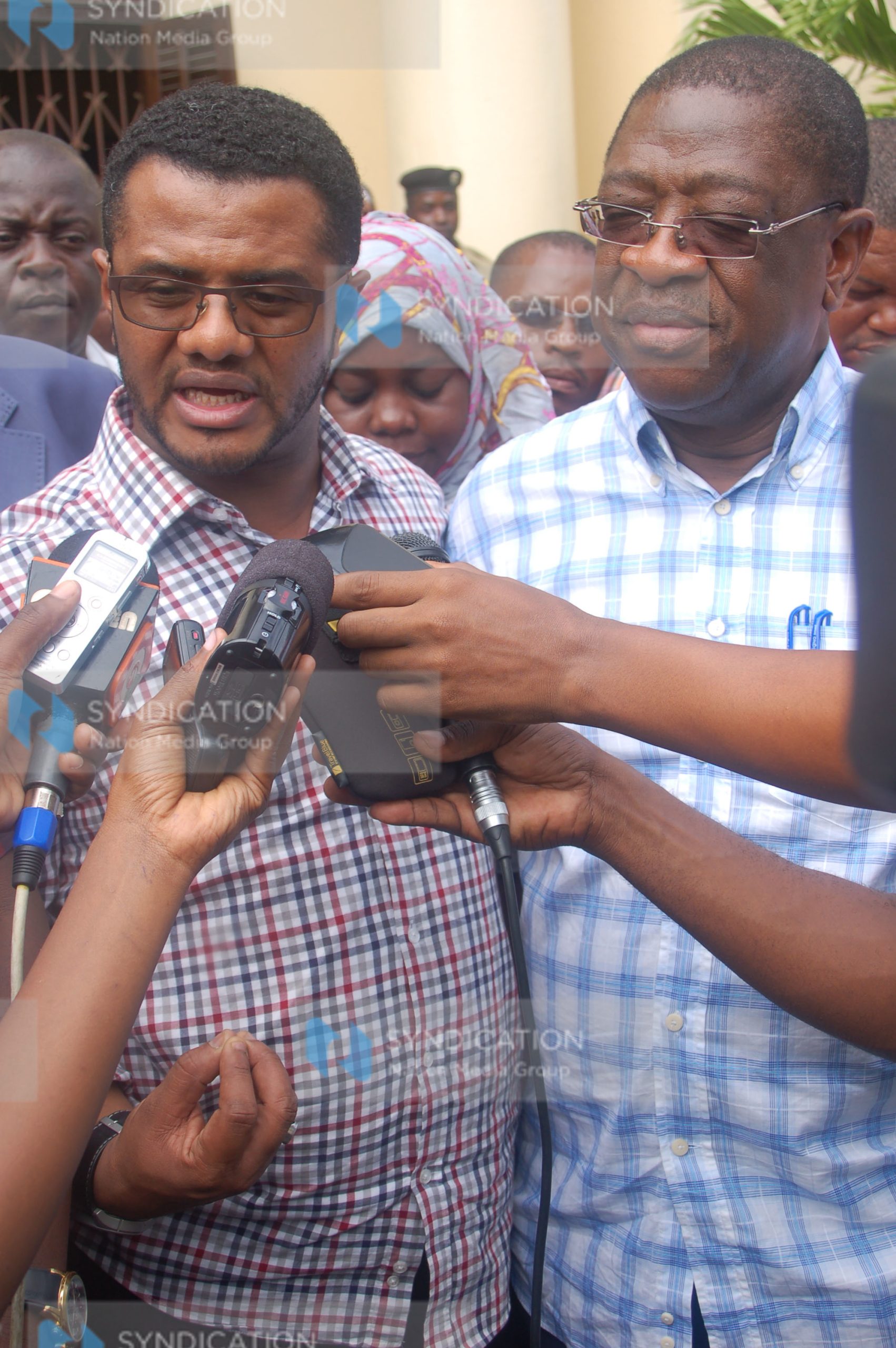 Hassan Omar and Senate Legal Affairs Committee Chairman Amos Wako address the media
