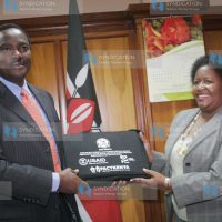 Vice President Kalonzo Musyoka, receives a gift from Naomi Wagereka