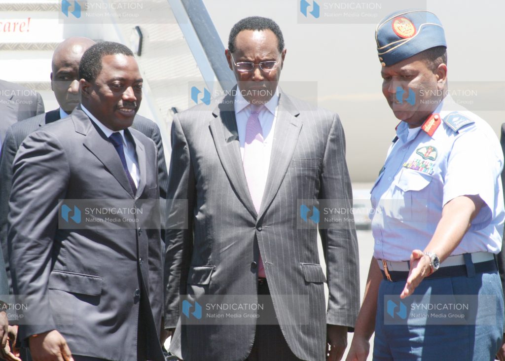 DRC's President Joseph Kabila is welcomed by the minister for defense George Saitoti