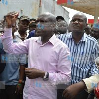 Kakamega Senator Dr. Boni Khalwale is surrounded by residents and town cleaners