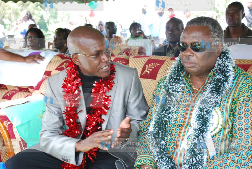 COTU secretary General Francis Atwoli listens to Ikolomani MP Boni Khalwale
