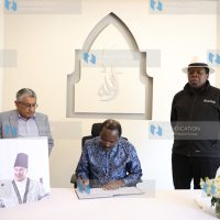 Kalonzo Musyoka as he signs a condolence book at Aga Khan Hospital