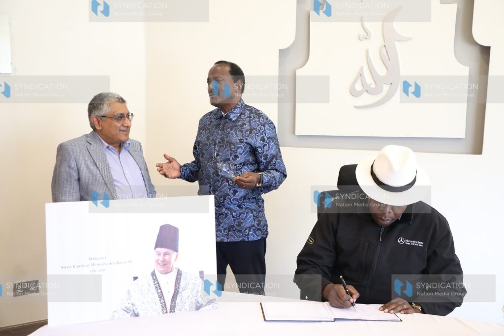 Eugene Wamalwa as he signs a condolence book