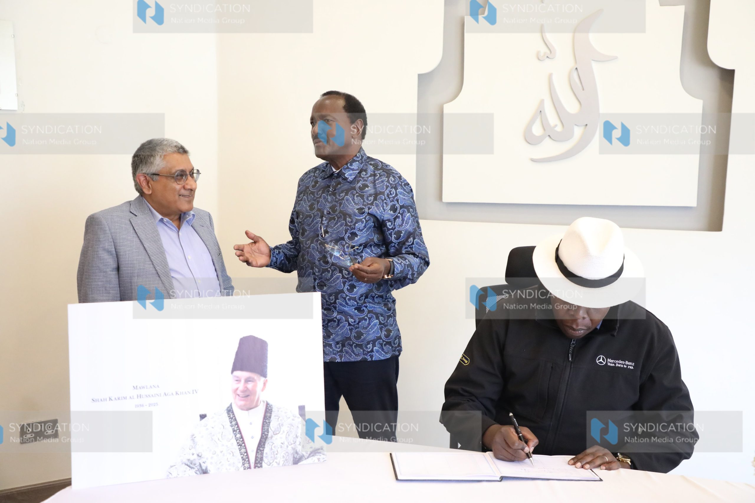 Eugene Wamalwa as he signs a condolence book