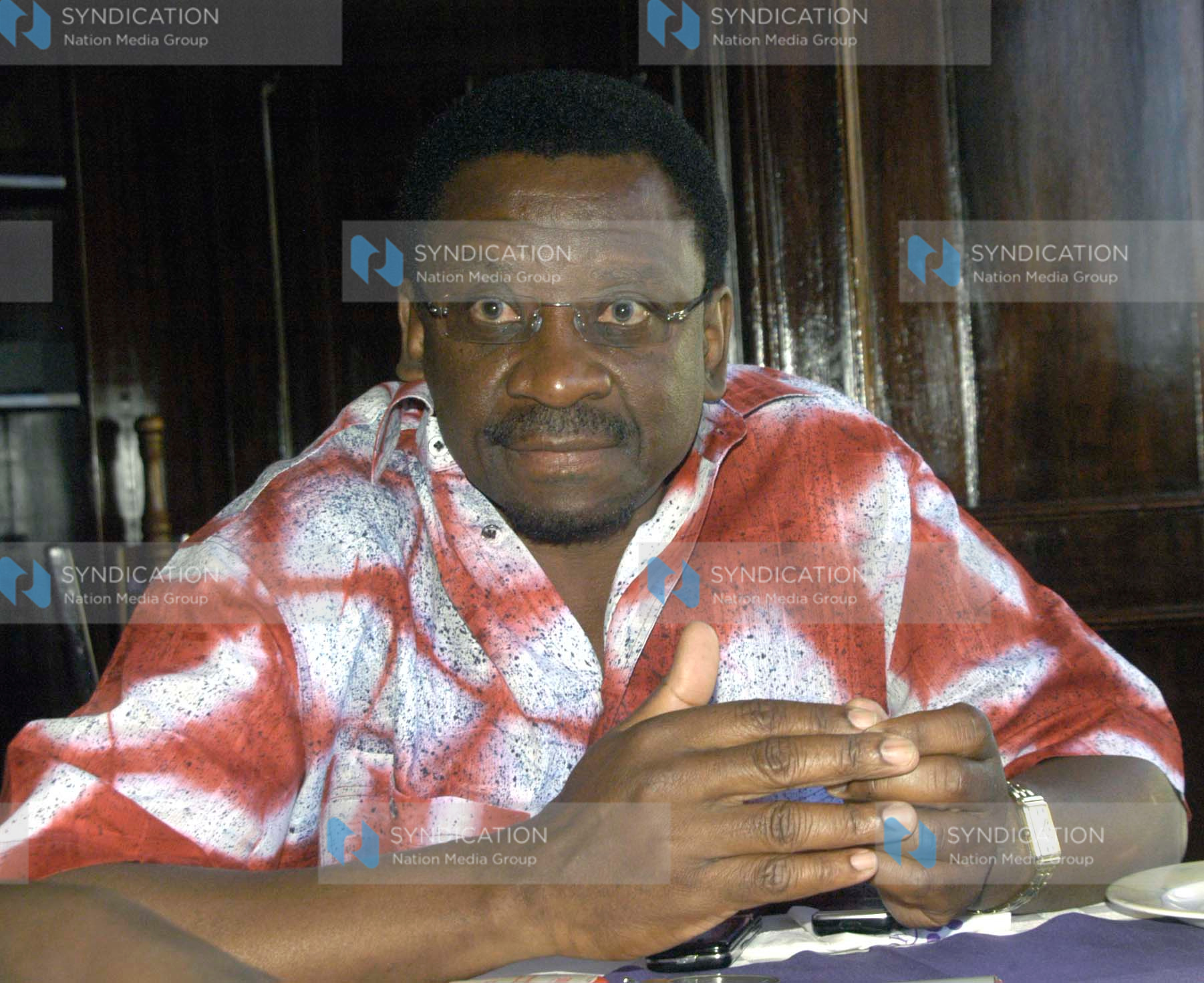 Lands Minister James Orengo addresses the press