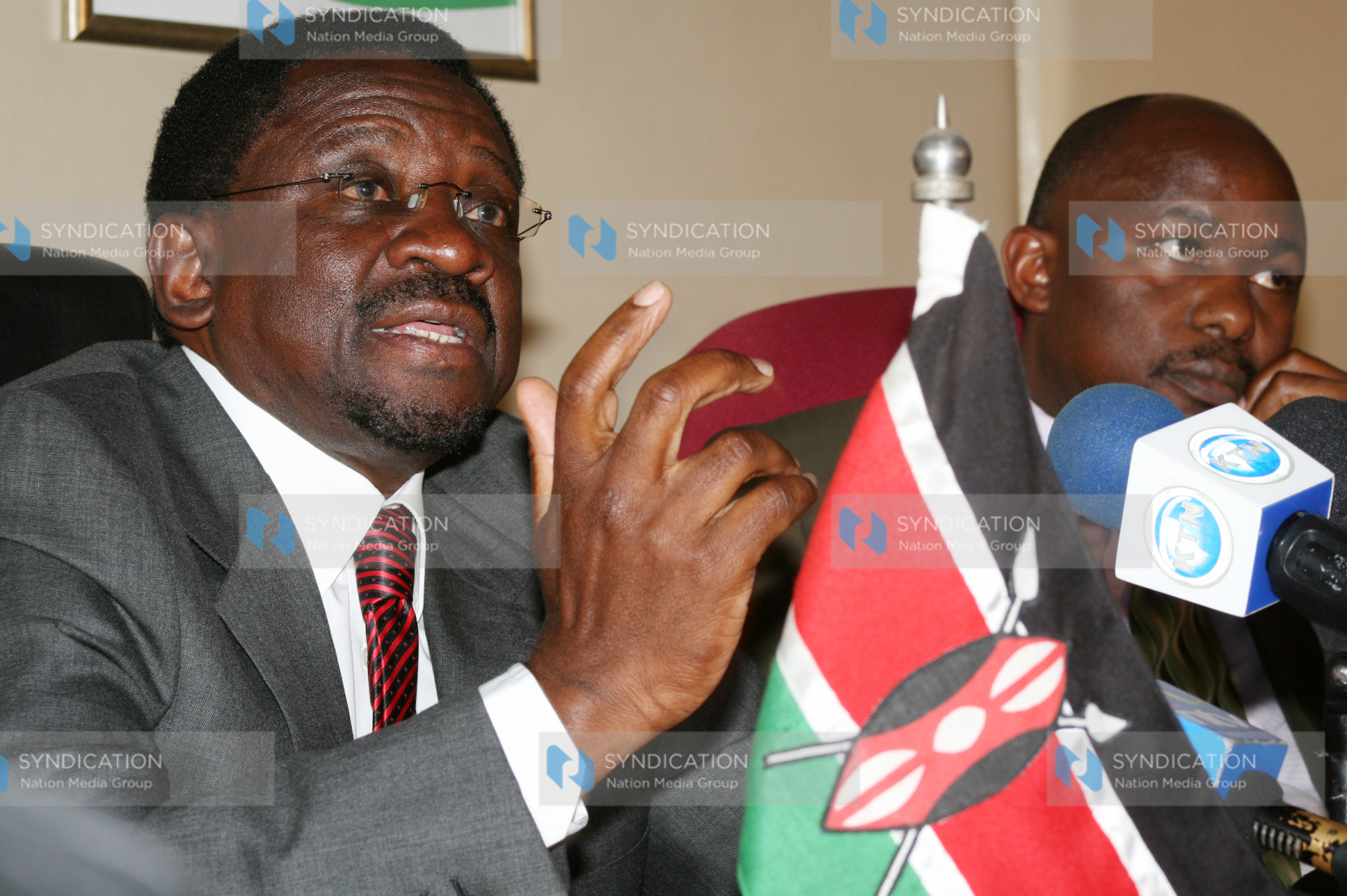Minister for Lands James Orengo (left) addresses a press conference